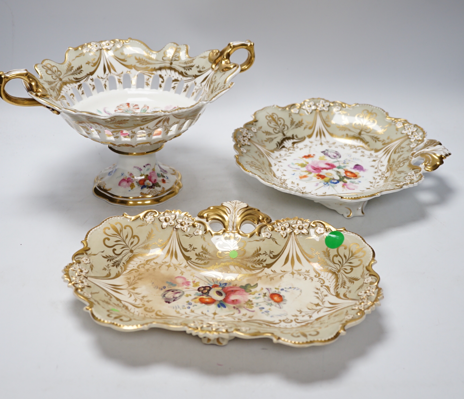 A Davenport porcelain part dessert service, each piece painted with a differing floral bouquet, within shaped grey and gilt borders